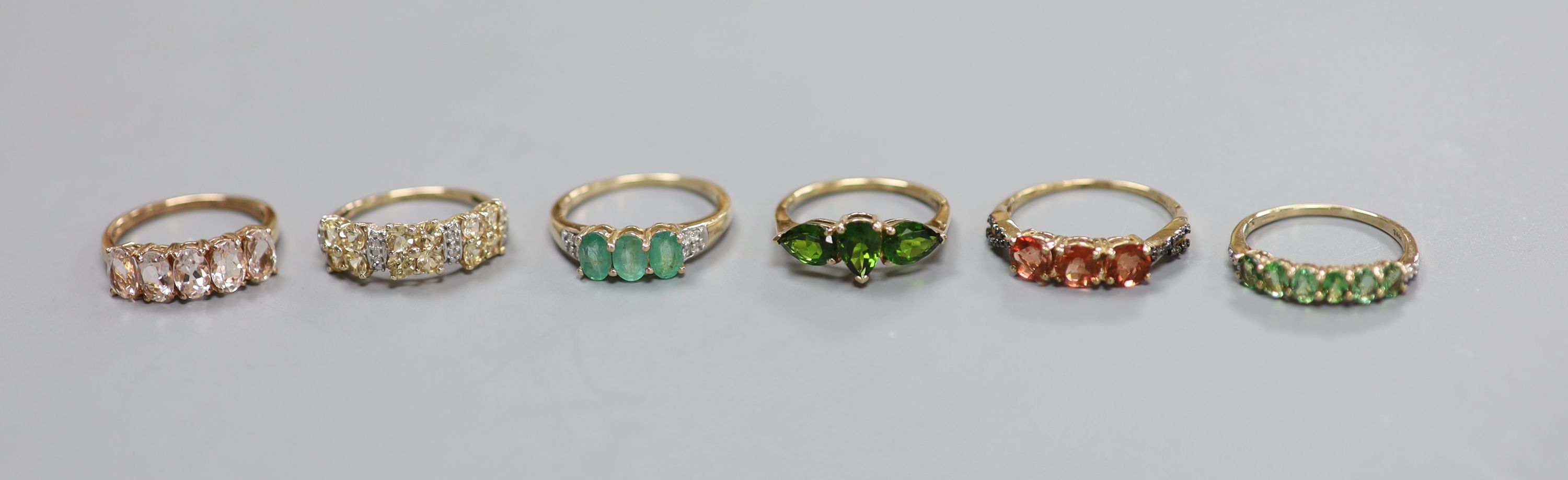 Five assorted modern 9ct gold and gem set dress rings and a similar 9k ring